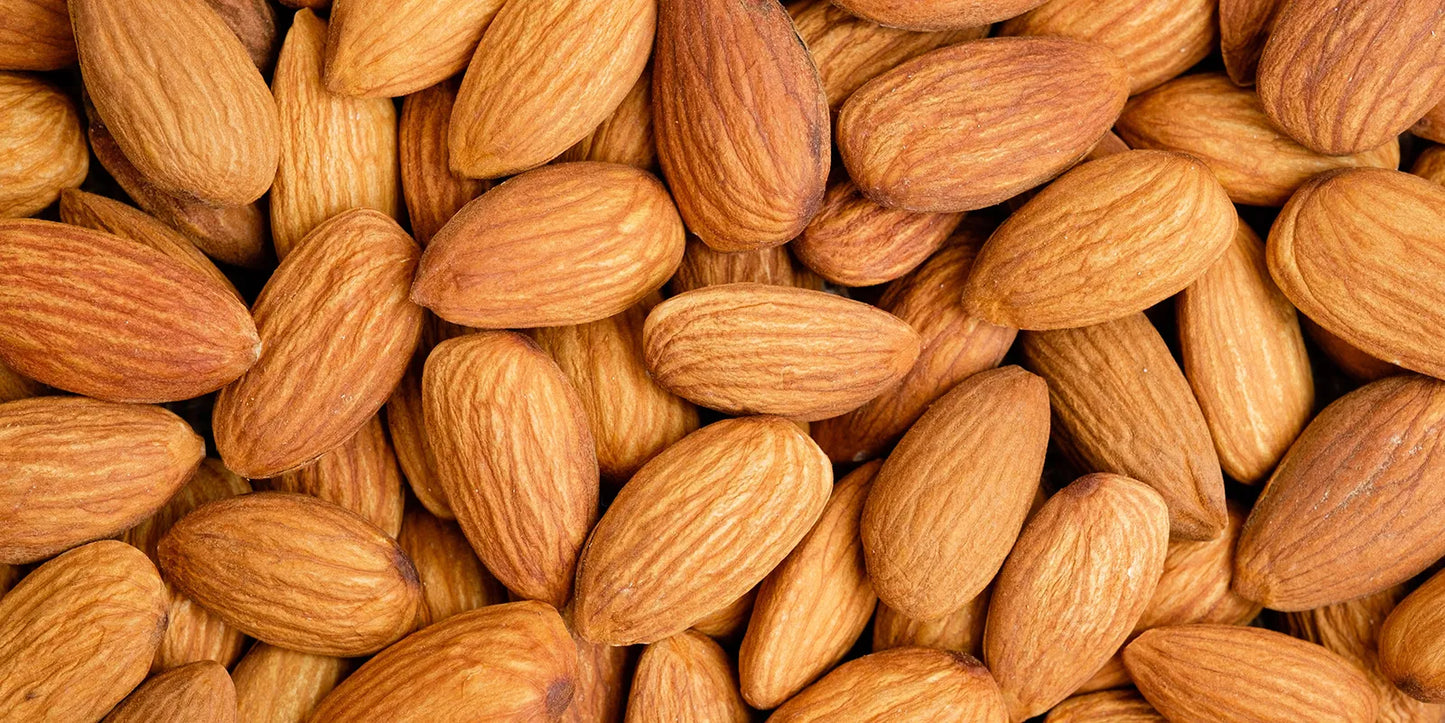A close-up of almonds, highlighting their texture, with a caption stating they are a great source of protein.