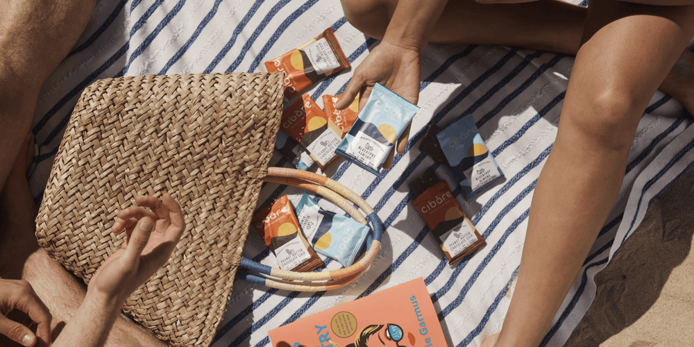 Packs of cibare bars in a beach setting